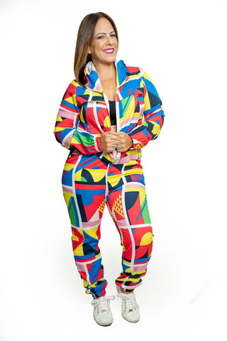 Set of pants and long-sleeved blouse and hat with a colorful print of geometric figures